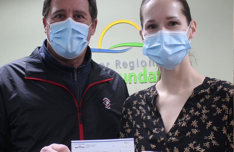 Brian Wittal, GM of Paterson Grain Foothills Terminal, presenting Manon Therriault of Red Deer  Regional Health Foundation with a donation of $10,000 courtesy of the Paterson Family Foundation
