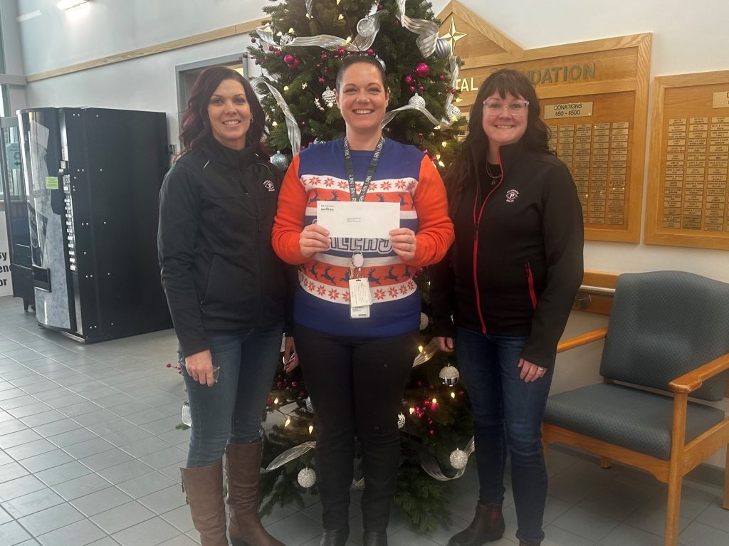 Amy Weller and Maggie Scheinbner of Paterson Grain presenting $10,000 to the Daysland Hospital