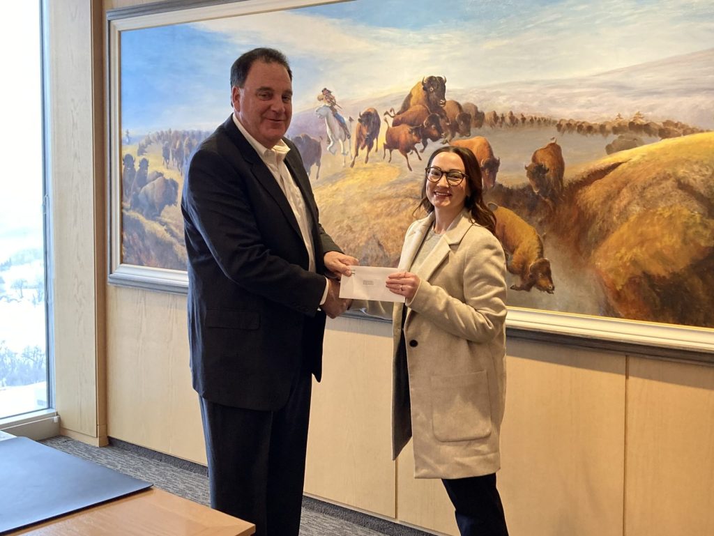 Andrew Paterson presenting a $30,000 donation to Jessica Bowman of Health Science Centre Foundation
