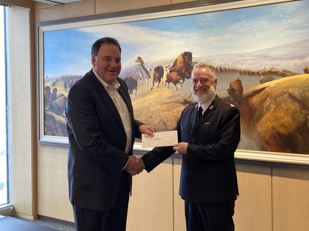 Andrew Paterson presenting a $100,000 donation to Bruce MacKenzie of the Salvation Army Winnipeg